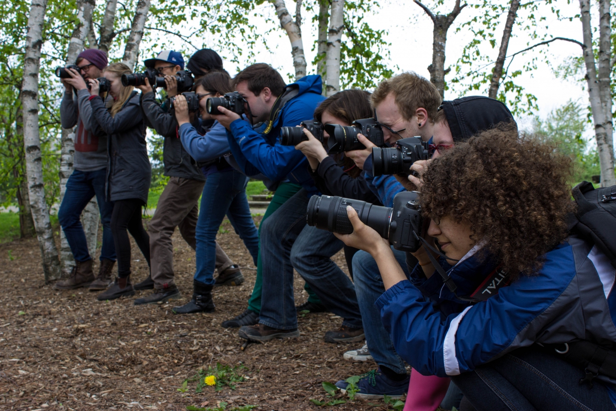 A dozen students aim their cameras in anticipation of some exciting Bioblitz action!