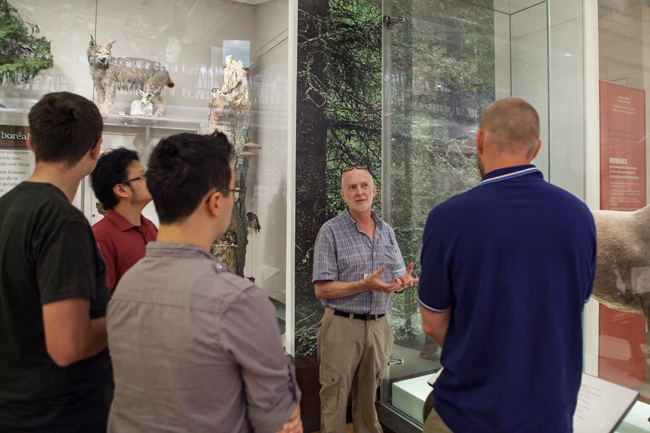 ROM Curator Doug Currie explains an exhibit in the Schad Gallery of biodiversity to a group of Game Jam participants. 