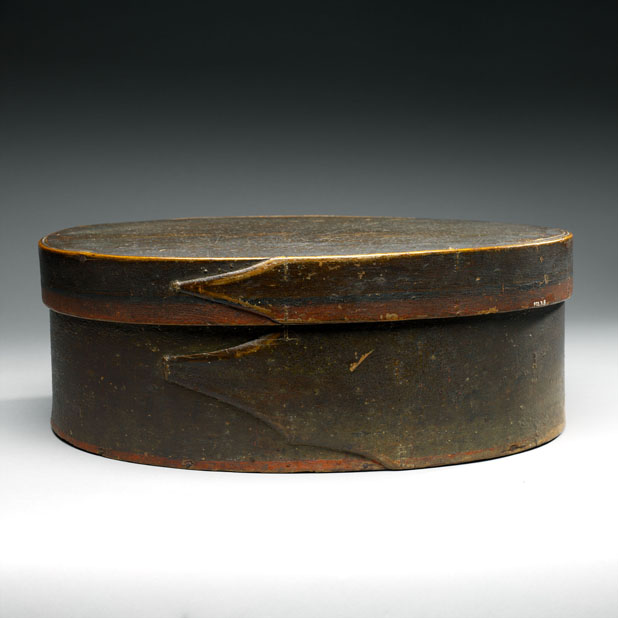 side detail of a wooden hat box