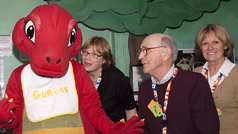 Volunteers with Gertie, ROM's youngest dino mascot.